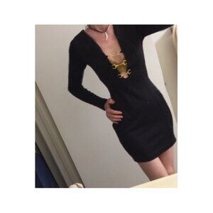 elegant black dress with V front and gold rings